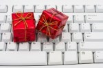 3619401-red-christmas-presents-on-grey-computer-keyboard-online-christmas-shopping